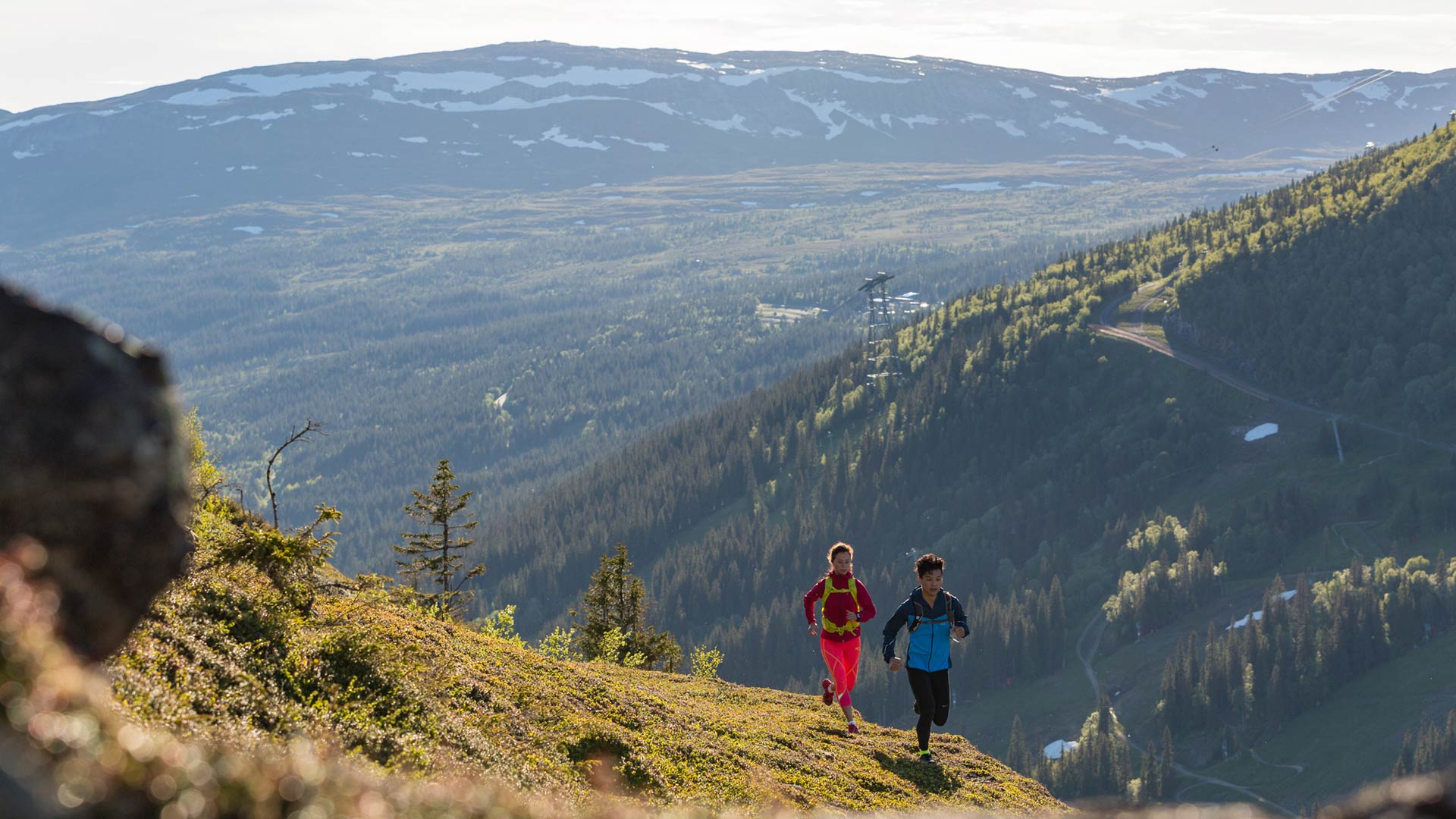 Two persons trailrunning i Åre an early summer day